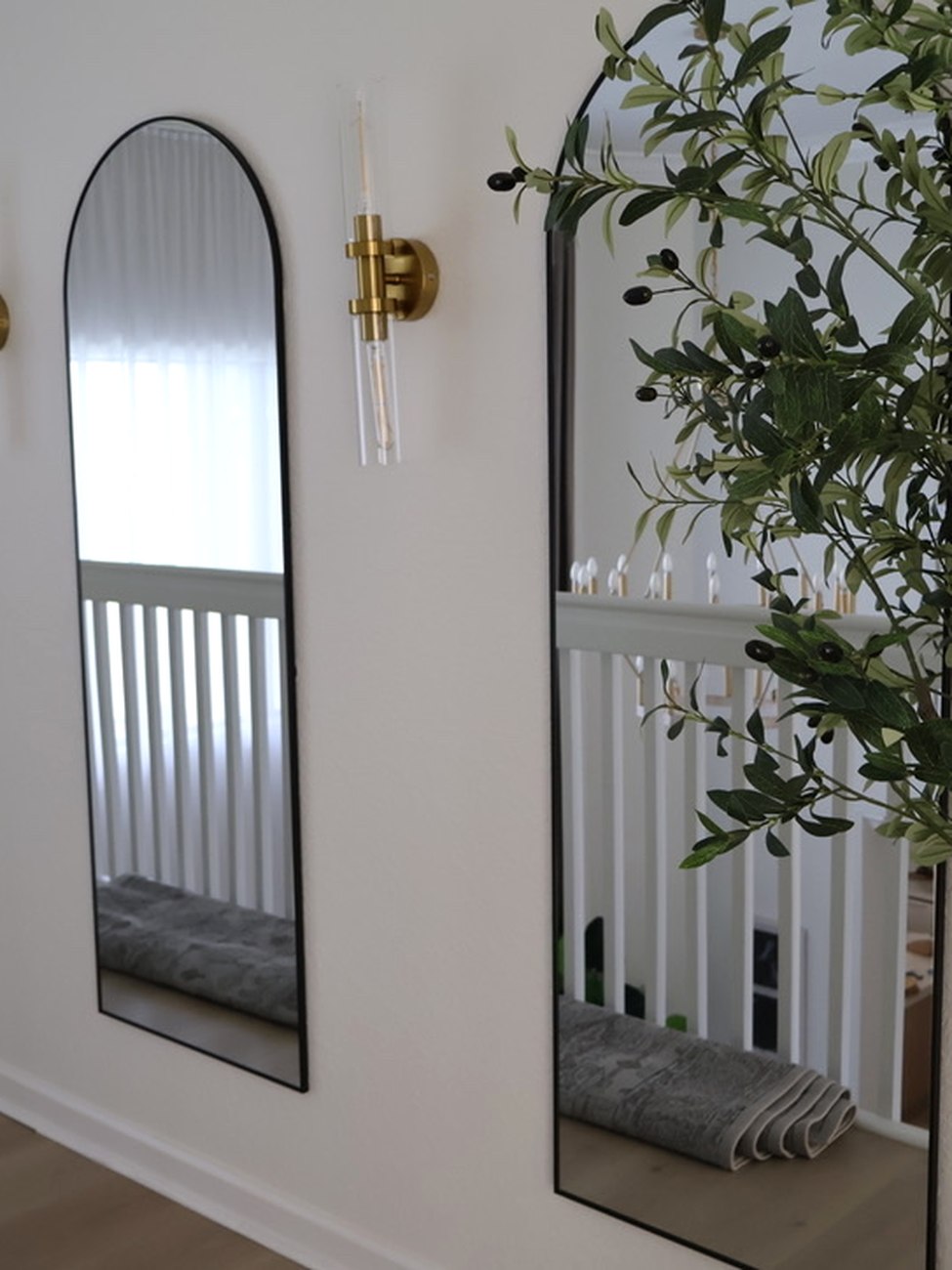 Arched mirrors and olive tree in Jen's home, shop on LTK